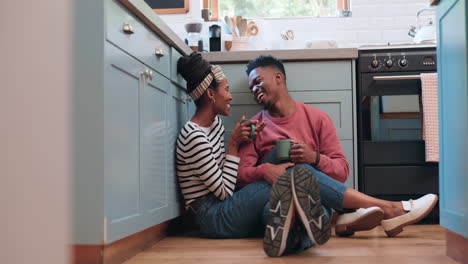 kitchen floor, tea cup and black couple smile