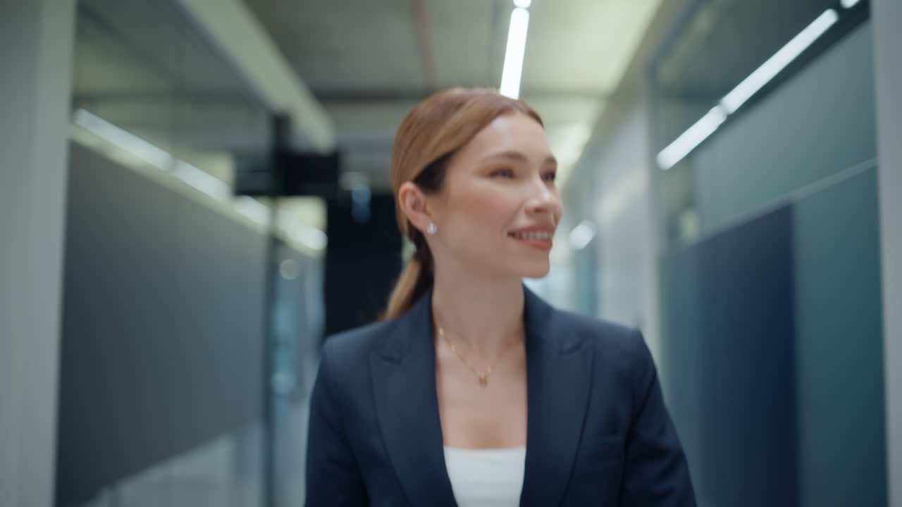 Friendly office manager greeting colleagues on go closeup. Smiling business lady