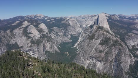 aerial reverse pull-back shot of yosemite valley from glacier point