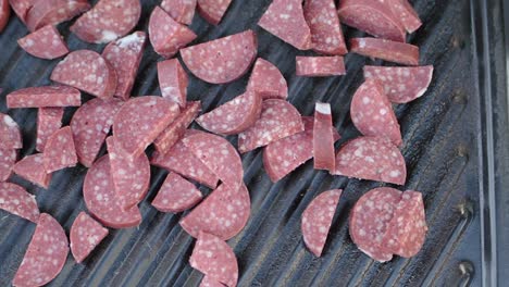 sliced sausage on a grill