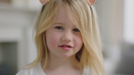 portrait-beautiful-little-girl-with-blonde-hair-smiling-looking-at-camera-happy-child-at-home