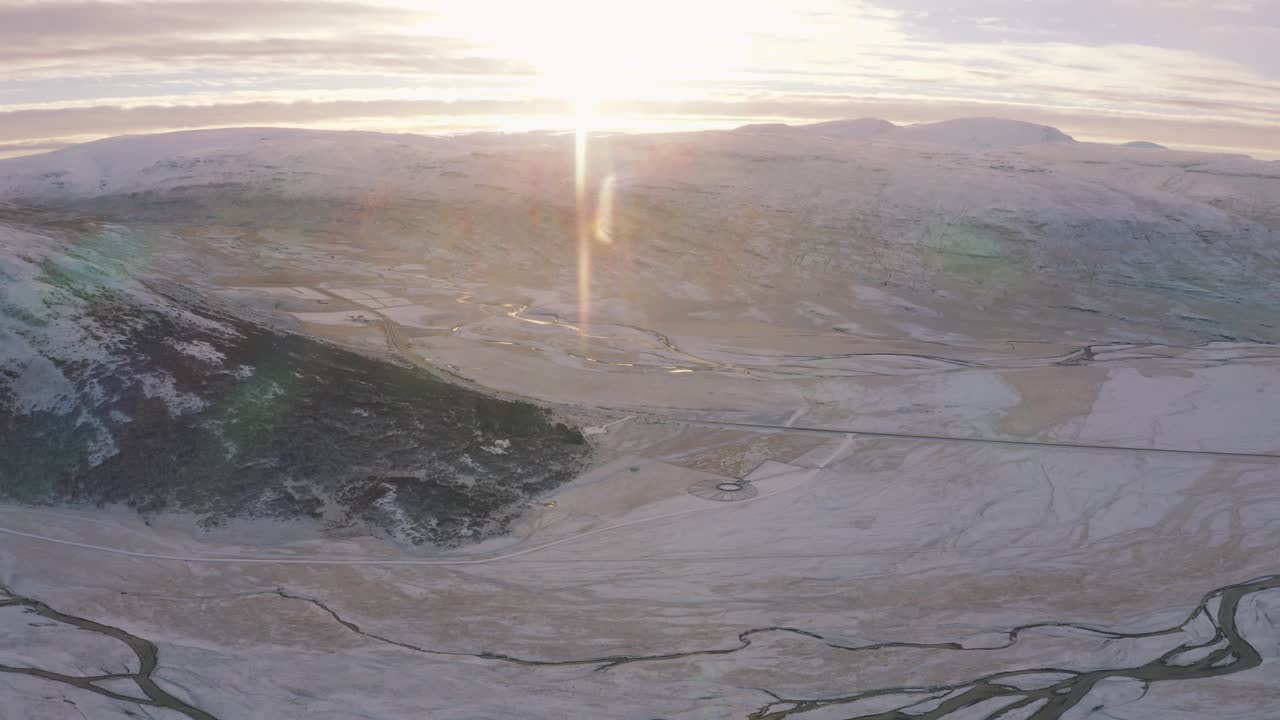 Vast White Landscape Over A Beautiful Sunset Scene In Iceland - aerial shot