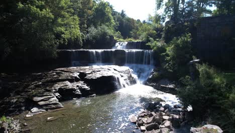 Aerial-view-from-drone-of-Keuka-Lake-Outlet-Trail-Falls-moving-sideways-across-the-falls