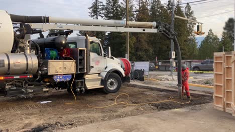 expert crew uses hydrovac truck to safely expose underground utility line