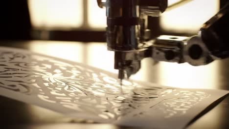 intricate robotic precision: a mechanized hand engaging in detailed paper cutting with artful designs illuminated by soft candlelight