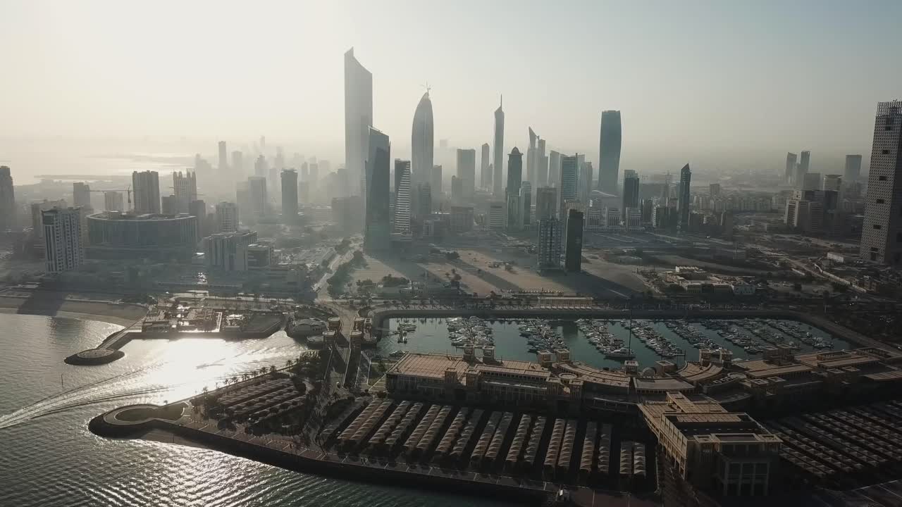 Aerial Footage of Kuwait City Skyline. Hazy Sunny Morning Shot With Smog. Sliding Left