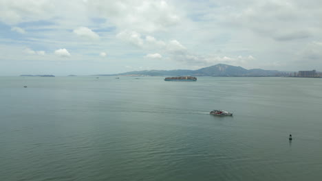 Ferry-And-Container-Ship-Travel-In-Opposite-Directions-Near-Xiamen-Port-China