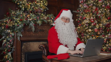 santa claus working on a laptop