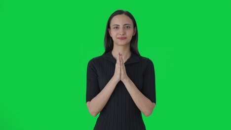 happy indian female news anchor doing namaste green screen