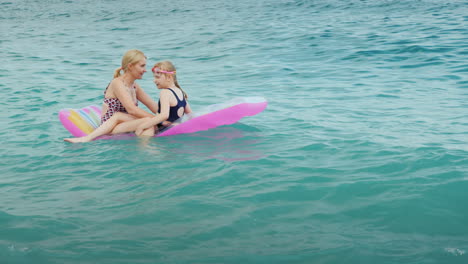 An-Active-Family-Vacation-With-Children-A-Young-Woman-With-A-Daughter-Are-Fun-To-Ride-The-Waves-On-A