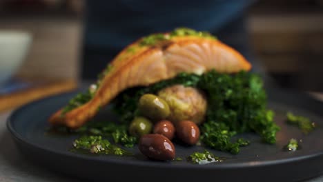 Close-shot-of-a-a-chef-preparing-an-appetising-salmon-dish