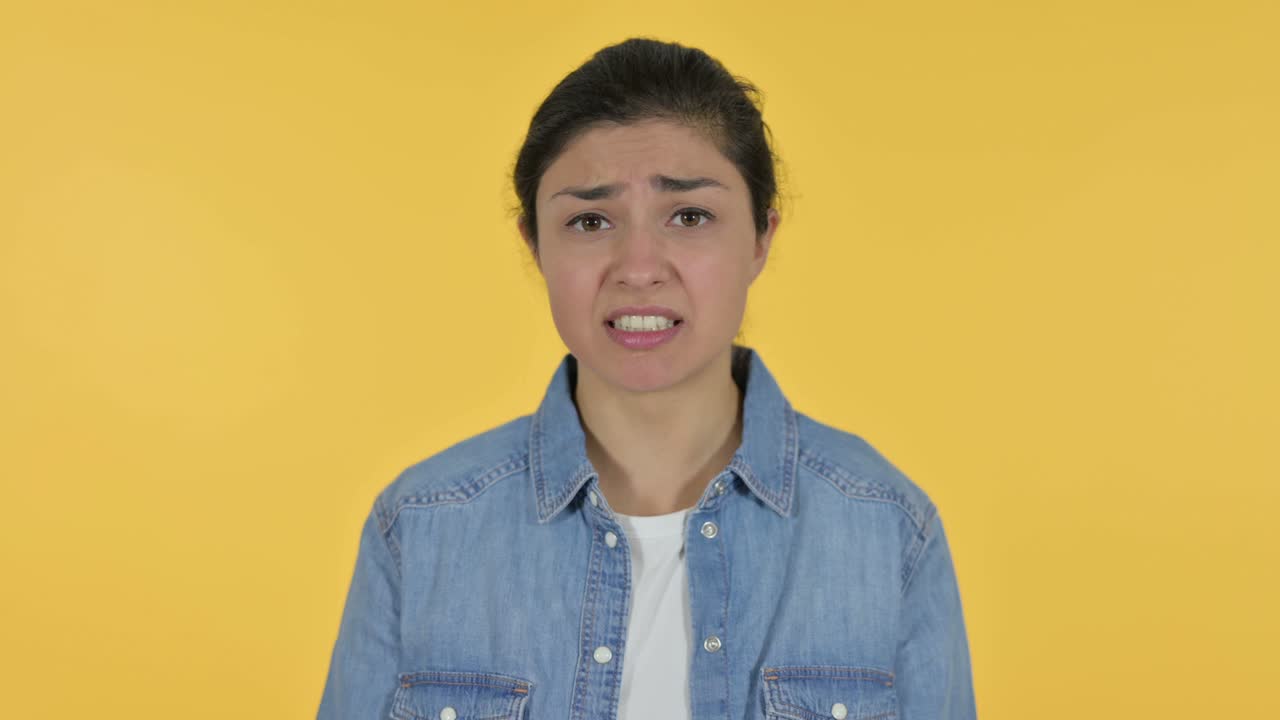 Annoyed Young Indian Woman Shouting, Yellow Background