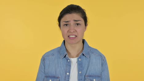 Annoyed Young Indian Woman Shouting, Yellow Background