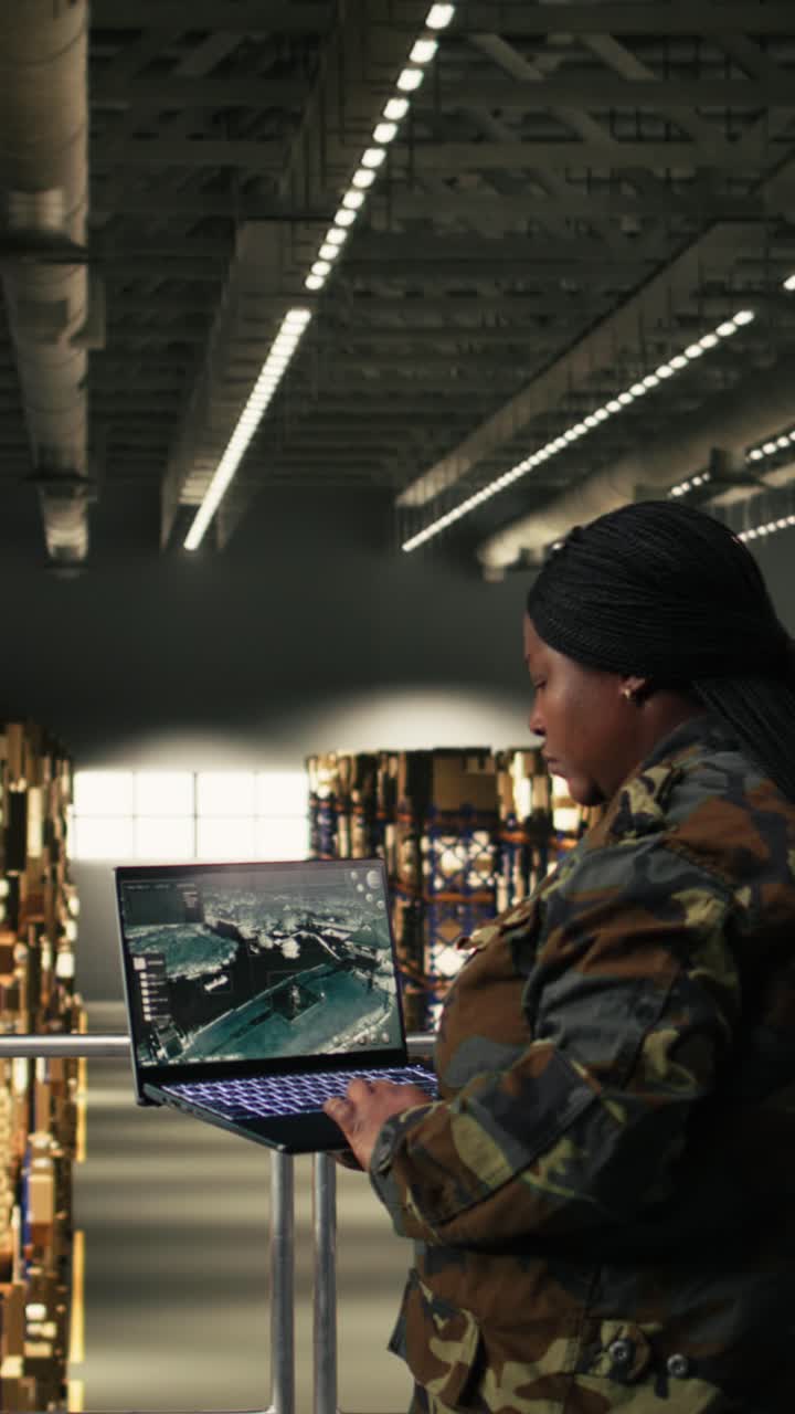 Vertical Video Female army officer, aerial surveillance, secure military warehouse