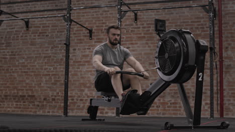 determinate sportsman exercising on exercise machine