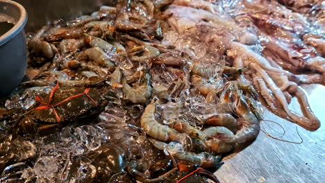 dead seafoods at local fish market at lombok in bali, indonesia