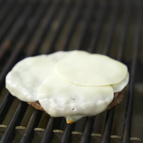 cutlet for burger with egg on top are fried on a large grill. fast food concept. tasty video