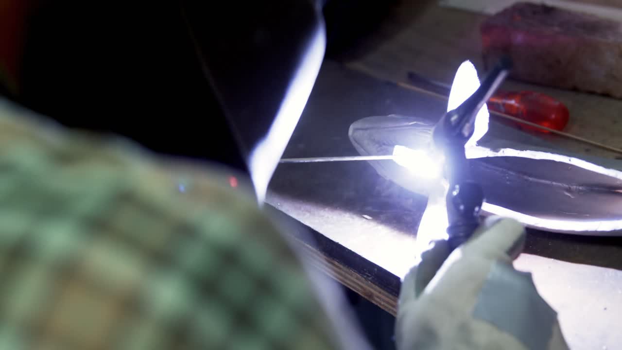 Welder working in workshop 4k