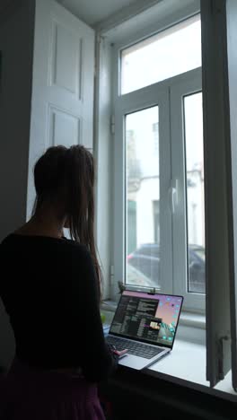 woman working from home at a window