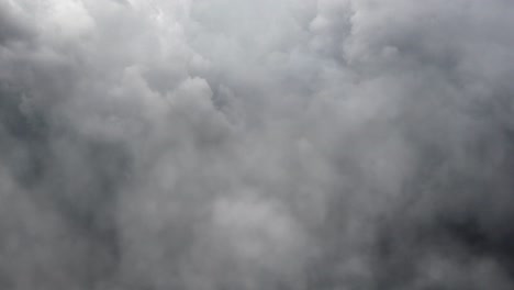 ominous storm cloud in dark sky