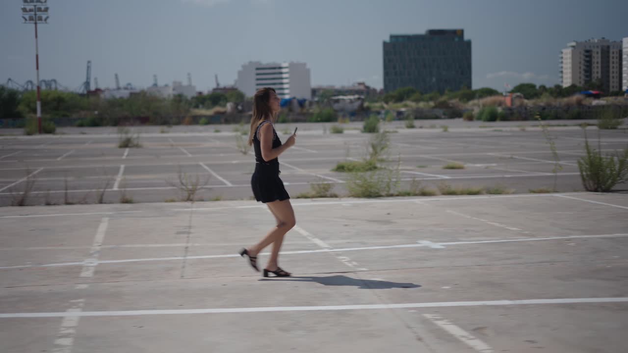 Woman Walking in an Empty Parking Lot