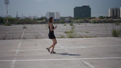 woman walking in an empty parking lot