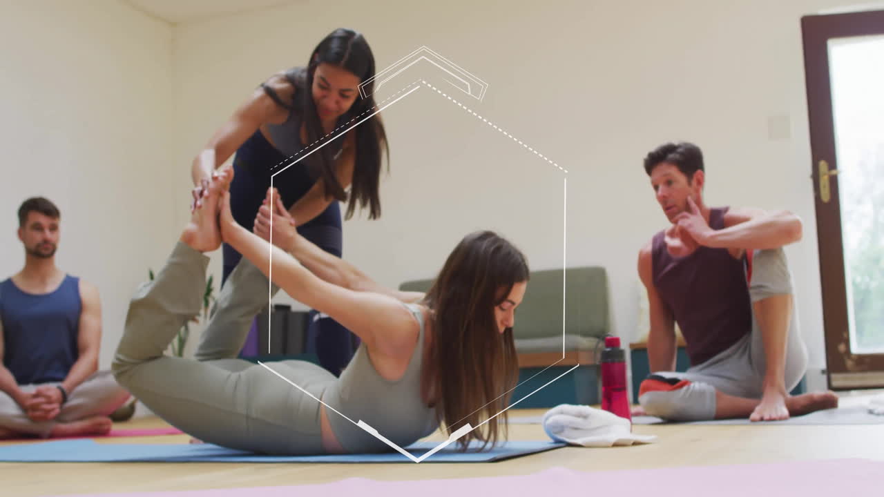 Yoga instructor assisting woman in stretch pose with geometric animation overlay