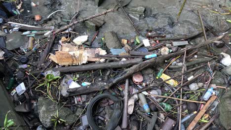 debris accumulates on shore over time.