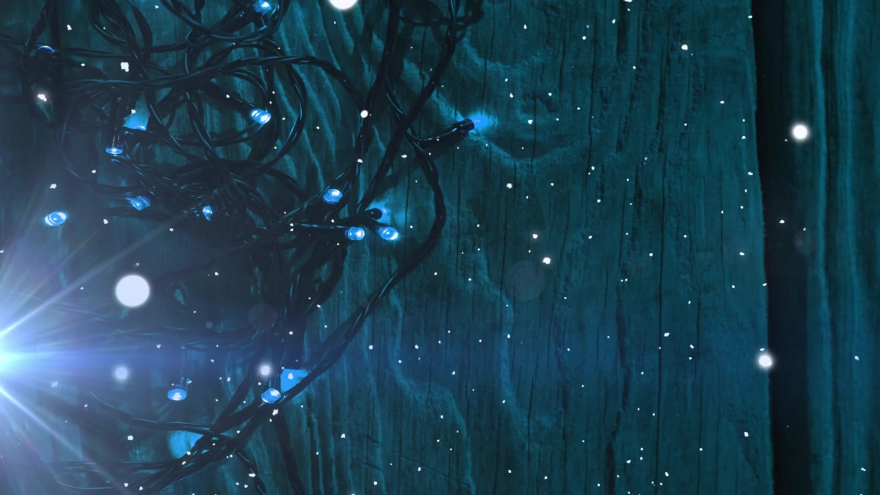 Animation of light moving over christmas lights on wooden surface