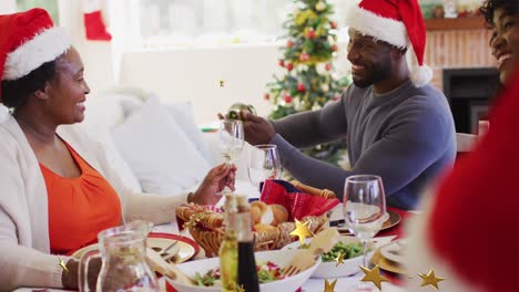 Multiple-golden-star-icons-floating-against-african-american-man-pouring-a-dink-for-his-mother