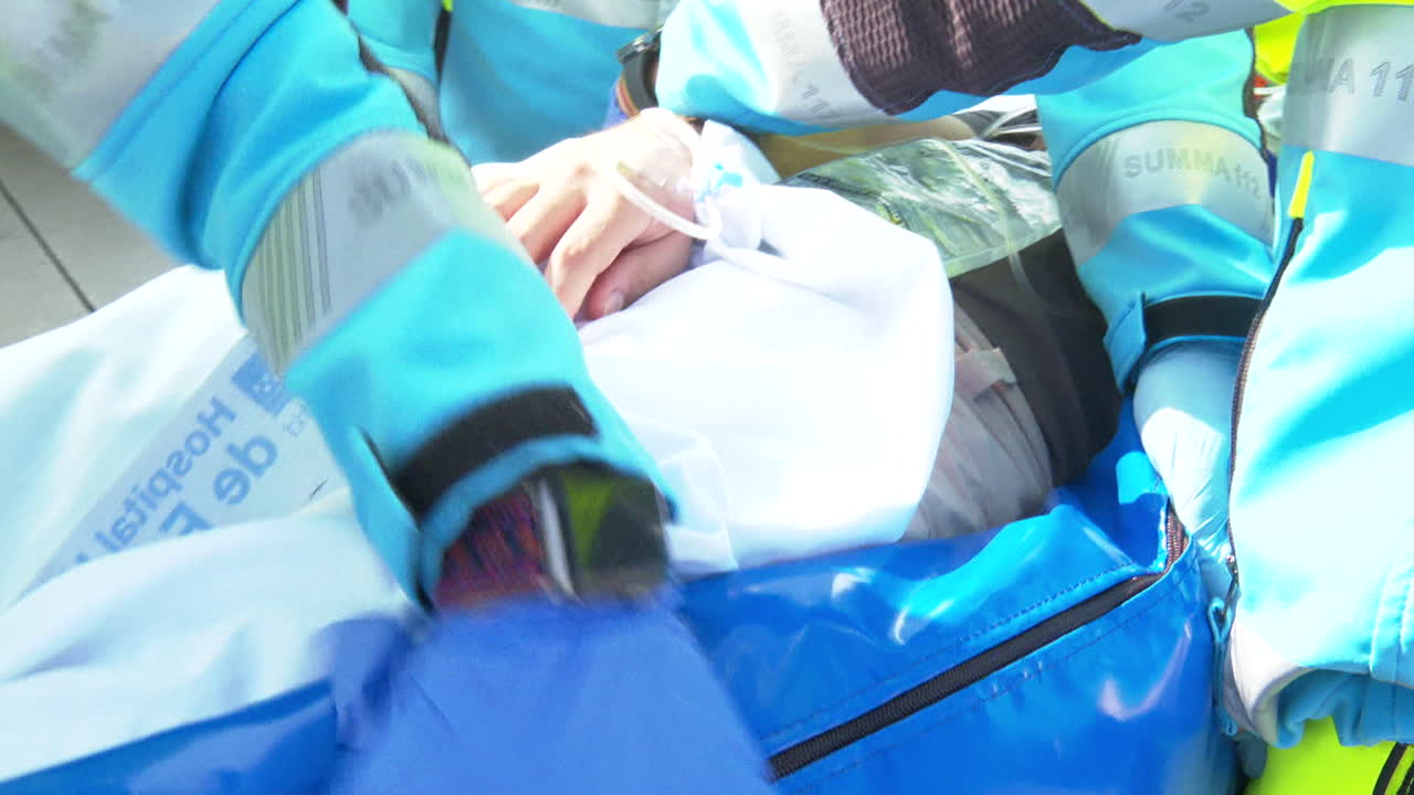 Paramedics Caring for Patient on Stretcher