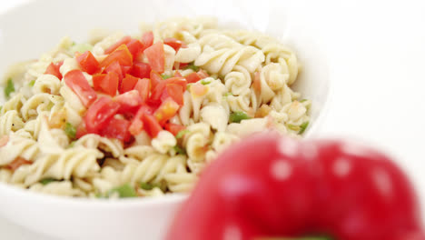 bell pepper with bowl of pasta