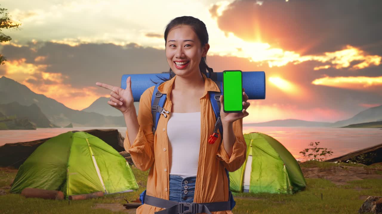 Happy Woman with Green Screen Phone on Camping Trip