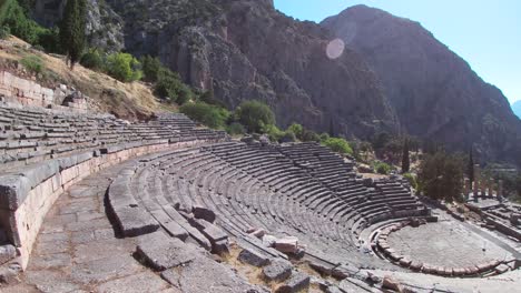 panoramic view at delphi amphitheatre with temple of apollo in greece