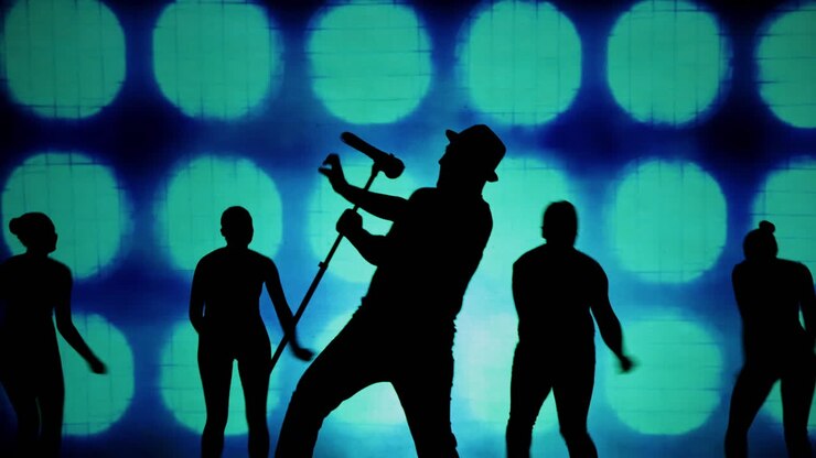 Silhouettes of dancers on a stage