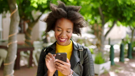 A-black-woman-texting-on-social-media-using