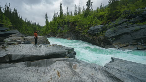 marmorfossen marmorslottet river, mo i rana, norway. one young brunette woman. nature cinemagraph.