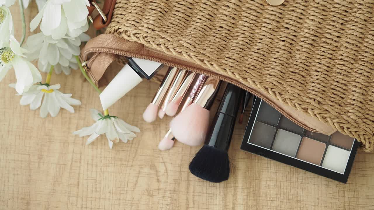 Makeup and accessories in a straw bag