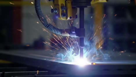 dynamic close-up of industrial welding process capturing the intensity of sparks and light emitted by the welding torch in a manufacturing environment