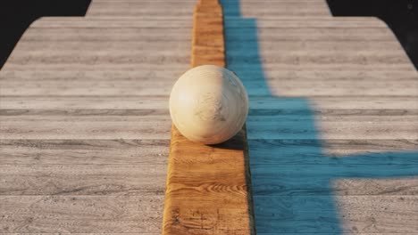 wooden ball on a plank