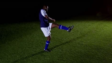 Soccer-player-kicking-the-ball-4k