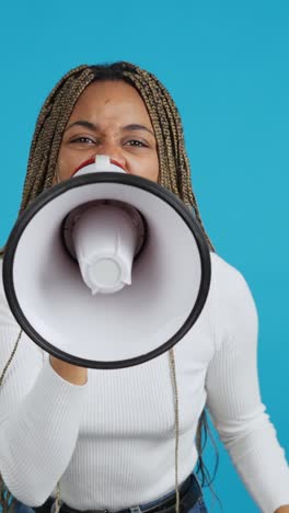 woman shouting into a megaphone