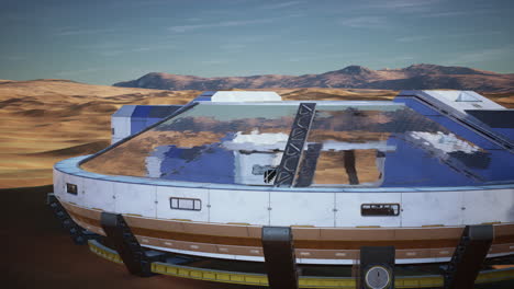futuristic glass building in desert dunes