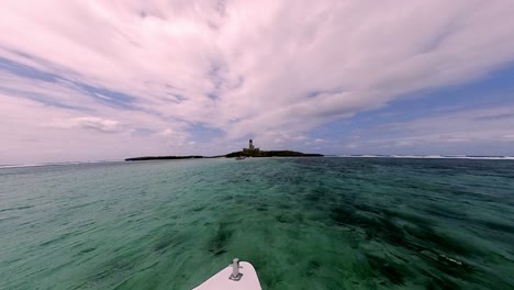 a scenic boat ride in mauritius with the iconic lighthouse island on the horizon, surrounded by crystal-clear waters.
