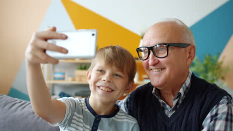 grandfather and grandson taking a selfie