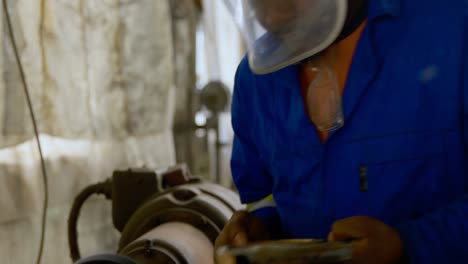 metalsmith working in workshop 4k