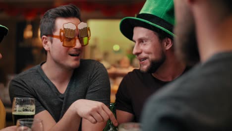 Friends-with-leprechaun's-hat-and-beer-celebrating-Saint-Patrick's-Day