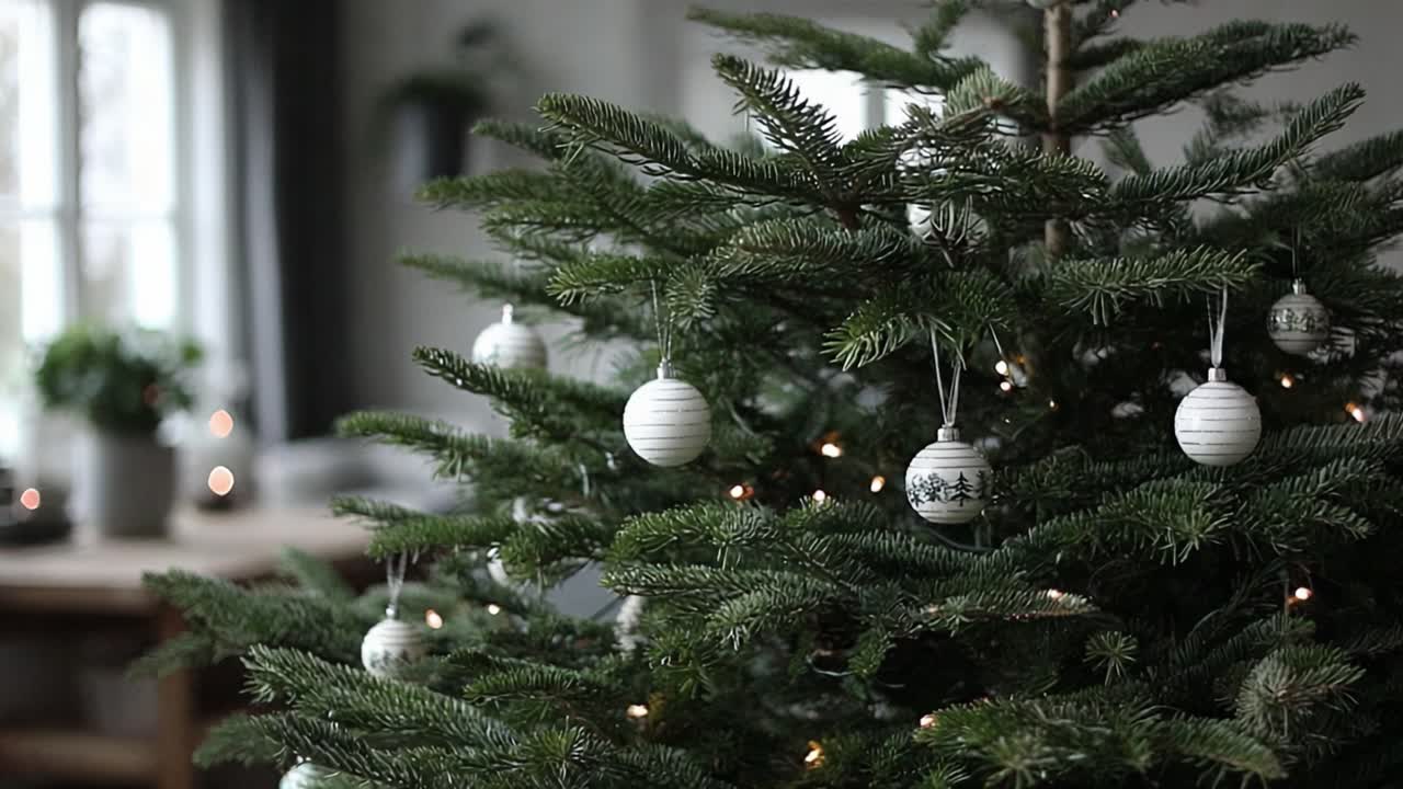 A Beautifully Decorated Christmas Tree with White Ornaments and Soft Lights, Creating a Warm and Festive Ambiance in a Cozy Living Room Setting