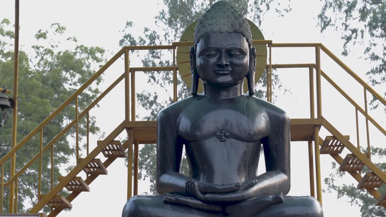 serene black marble buddha idol at outdoor in daylight at sarnath in day at Sarnath near Varanasi, India