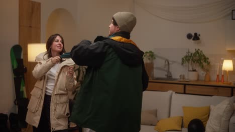 couple and child dancing at home